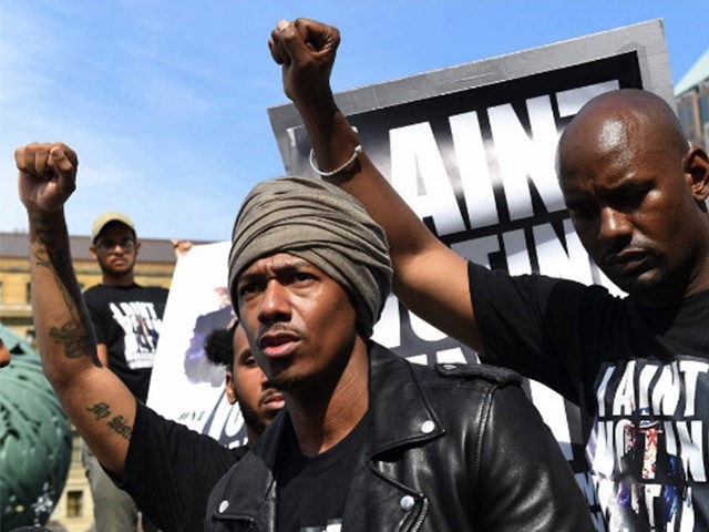 Nick Cannon joins protesters in St. Louis wearing a Colin Kaepernick jersey