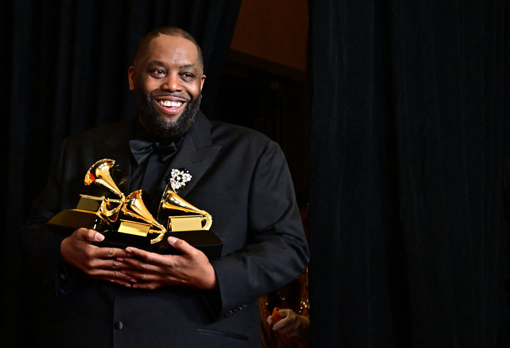 Killer Mike holding his three Grammys