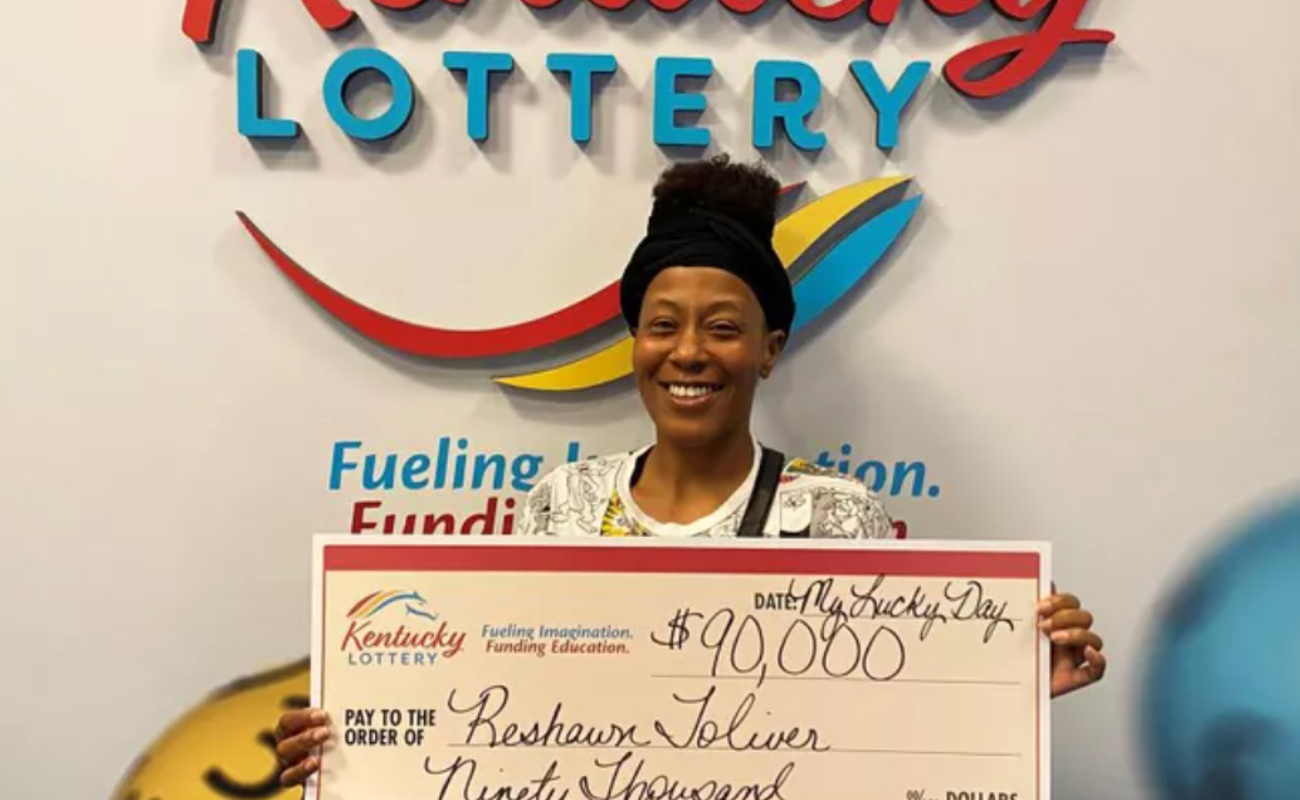 Lottery winner Reshawn Toliver with $90,000 prize