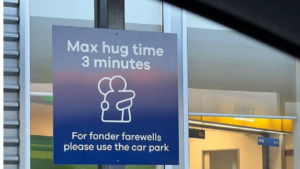 An airport in New Zealand has enforced a hugging time limit