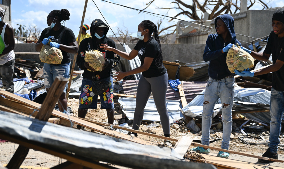 Love To See It! Tourists Roll Up Their Sleeves To Help Clean Up Jamaica After Hurricane Melissa’s Devastation